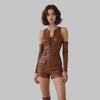 Woman wearing brown genuine leather lace up sleeveless romper with long gloves and belt